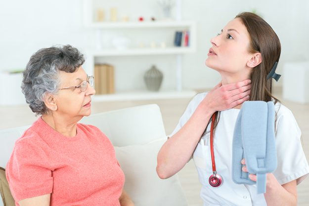 Picture of an elderly woman with her caregiver doctor