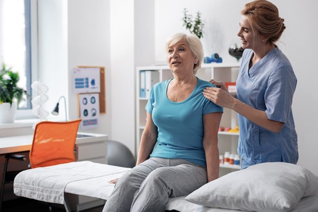Positive nice aged woman receiving pleasant massage