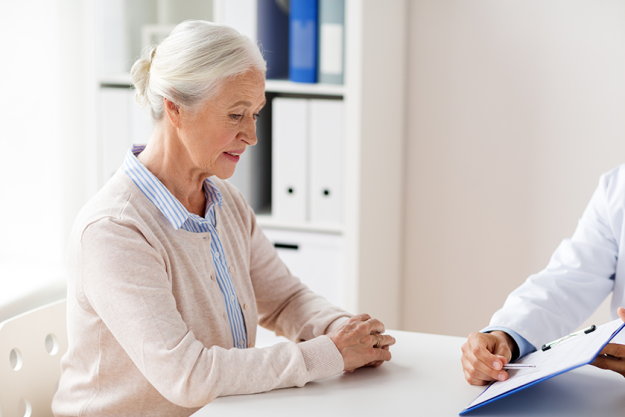 Senior woman and doctor meeting at hospital