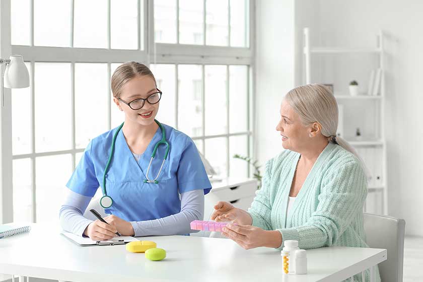 Doctor giving pills patient clinic