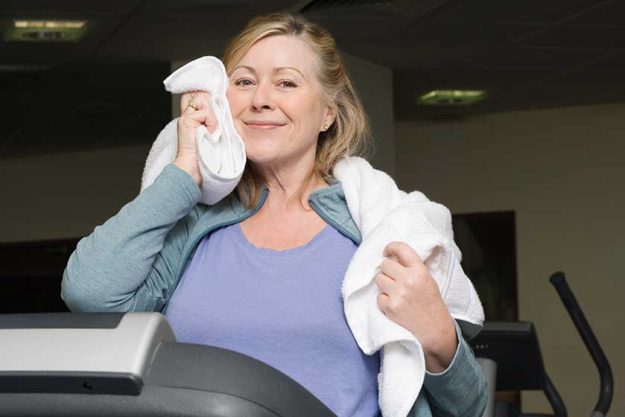 Mature woman drying face