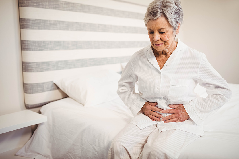 senior woman suffering from stomach ache Senior woman suffering from stomach ache
