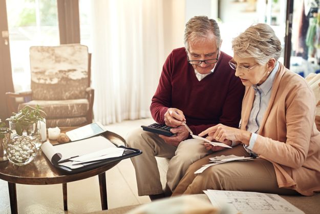 Its necessary to have a contingency plan for old age. an elderly couple working out a budget while sitting on the living room sofa. 16 Questions To Ask Yourself When Planning For Retirement In A La Porte, TX Active Senior Living Home
