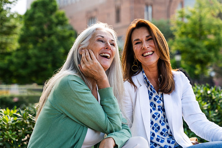 Beautiful senior women bonding outdoors