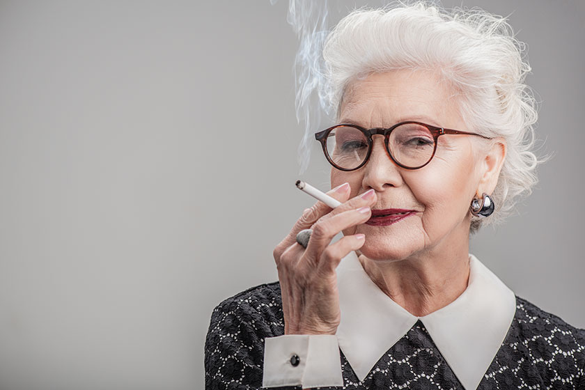 happy aged lady enjoying ciggy