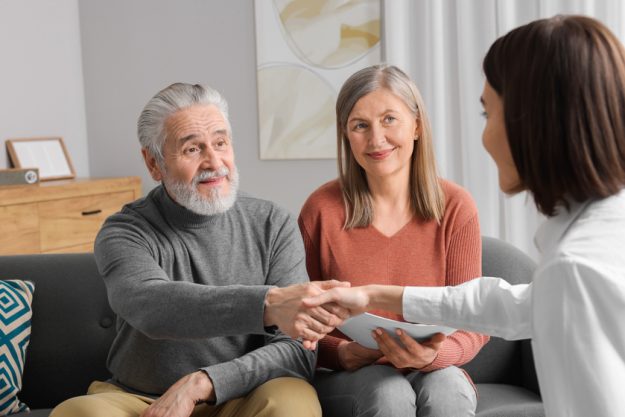 Insurance agent consulting elderly couple about pension plan in How A Care Manager In Senior Living Communities In Joshua, TX Helps The Residents And Families