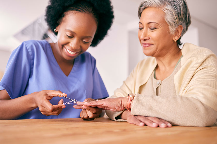 Manicure, elderly woman and nurse in retirement