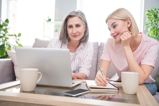 Photo of happy charming grey haired retired woman blonde lady sit
