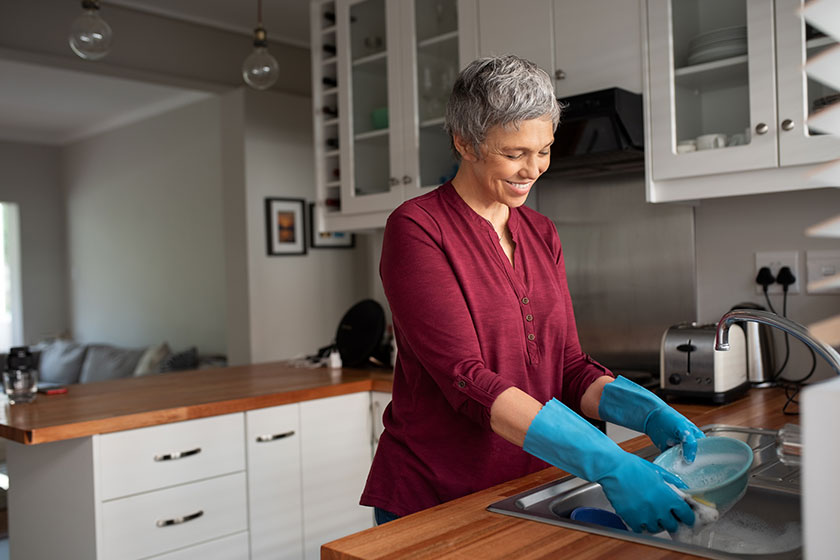 senior woman washing dishes her kitchen cheerful mature housewife kitchen
