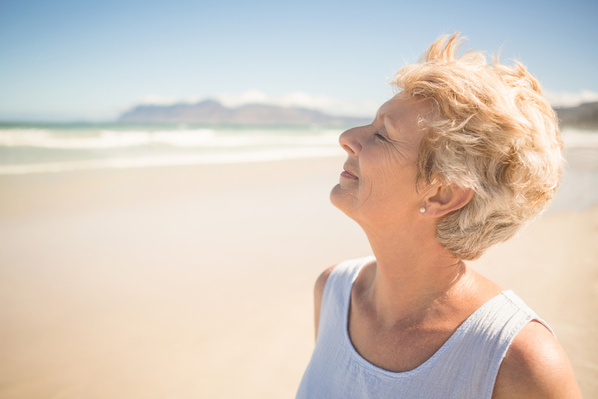 Close up of smiling senior woman with eyes closed