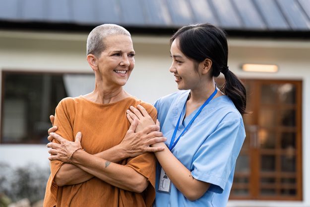 Elderly touch hand back hand caregiver nurses express thankful