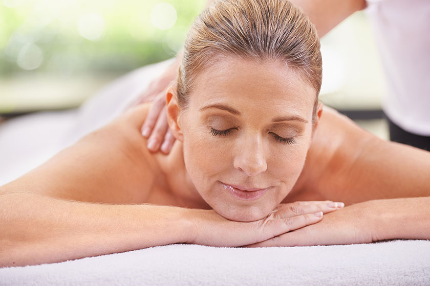 Getting pampered professional woman day spa relaxing massage table Getting pampered professional woman day spa relaxing massage table
