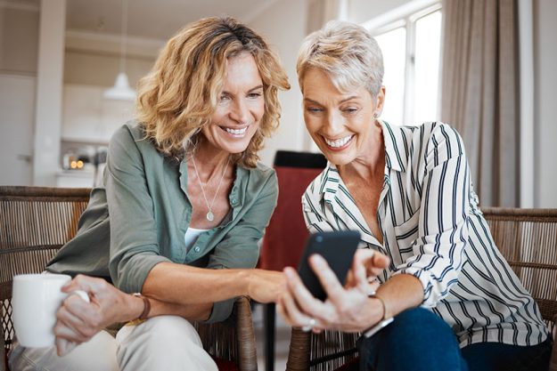 Have show you photos two female friends drinking coffee while
