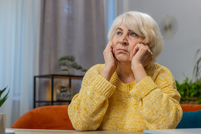 Portrait sad stressed senior old grandmother woman sits home looks Portrait sad stressed senior old grandmother woman sits home looks