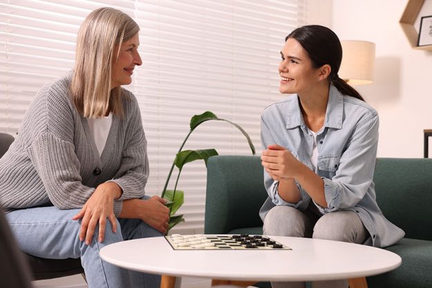 Women playing checkers coffee table room