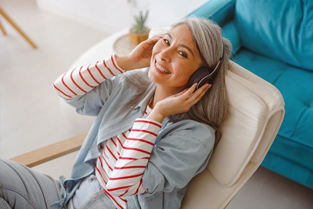 Cheerful woman listening to music