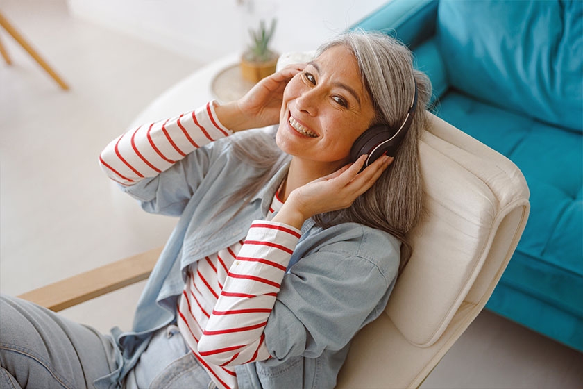 Cheerful woman listening to music