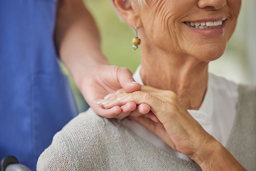 Closeup doctor patient holding hands zoom doctor offering patient support