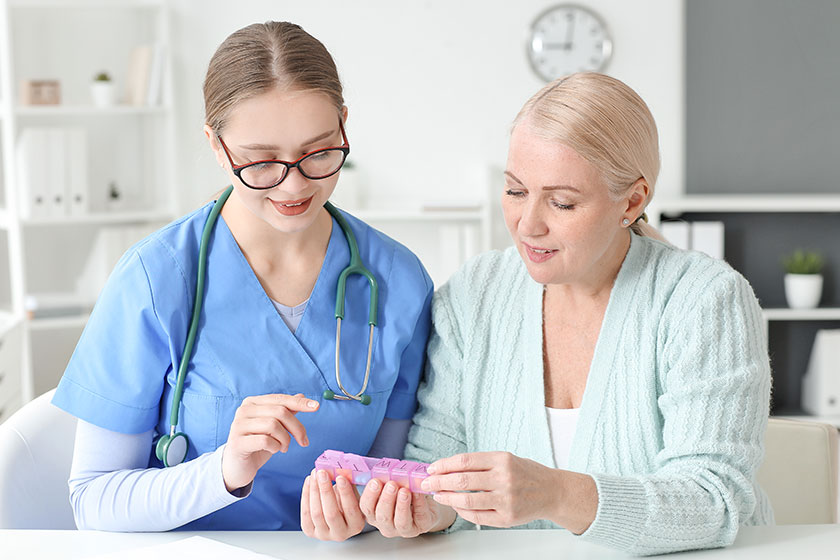 Doctor giving pills patient clinic