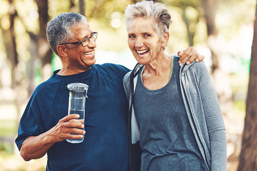 Exercise senior couple park water bottle training workout smile mature
