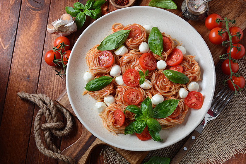 italian colorful pasta dish spaghetti napolitana cherry tomatoes vegan mozzarella italian colorful pasta dish spaghetti napolitana cherry tomatoes vegan mozzarella
