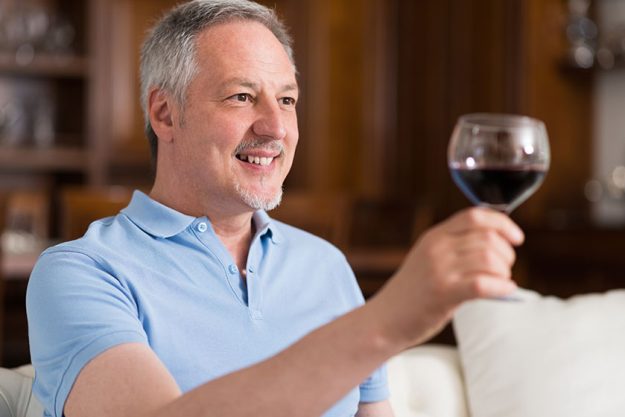 Man enjoying glass of red wine Man enjoying glass of red wine