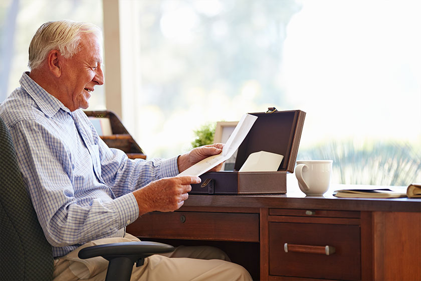 Man Putting Letter Into Box