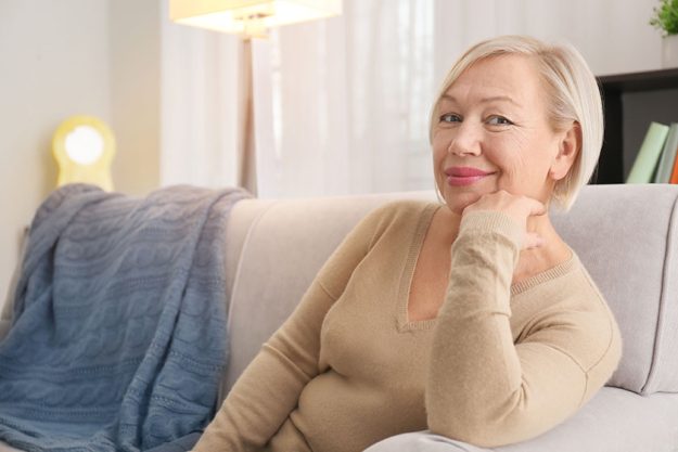 Portrait beautiful mature woman resting home Portrait beautiful mature woman resting home
