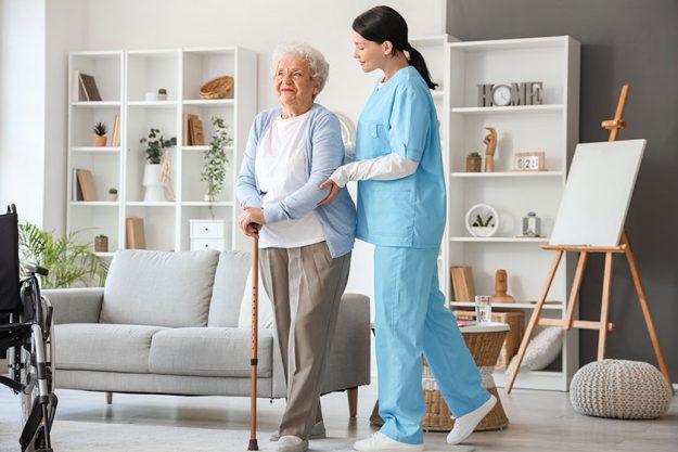Senior woman walking stick nurse home