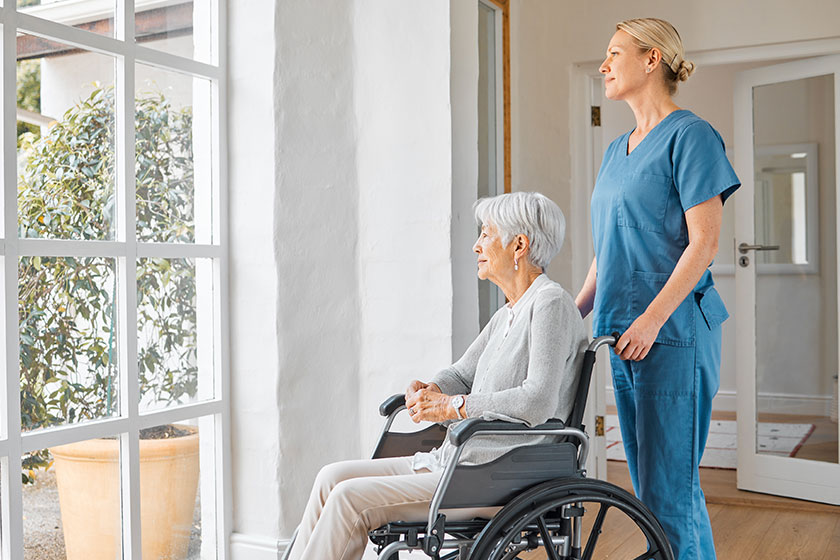 Theres comfort found calm nurse caring senior woman wheelchair retirement