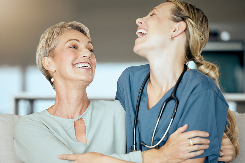 Two happy smiling women only showing bond patient doctor checkup