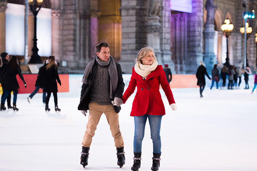 beautiful senior couple ice skating in city centre winter beautiful senior couple ice skating in city centre winter