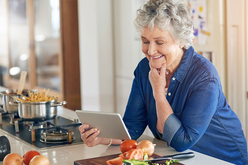 connected all her favourite cooking blogs senior woman using digital connected all her favourite cooking blogs senior woman using digital