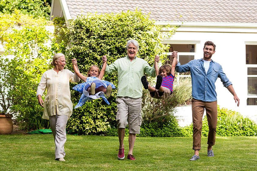 family playing in yard family playing in yard