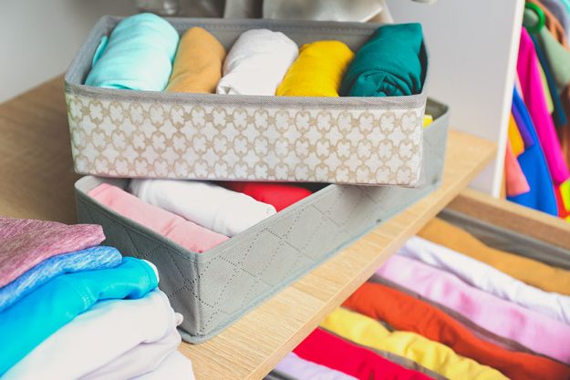 Organizers clean clothes closet