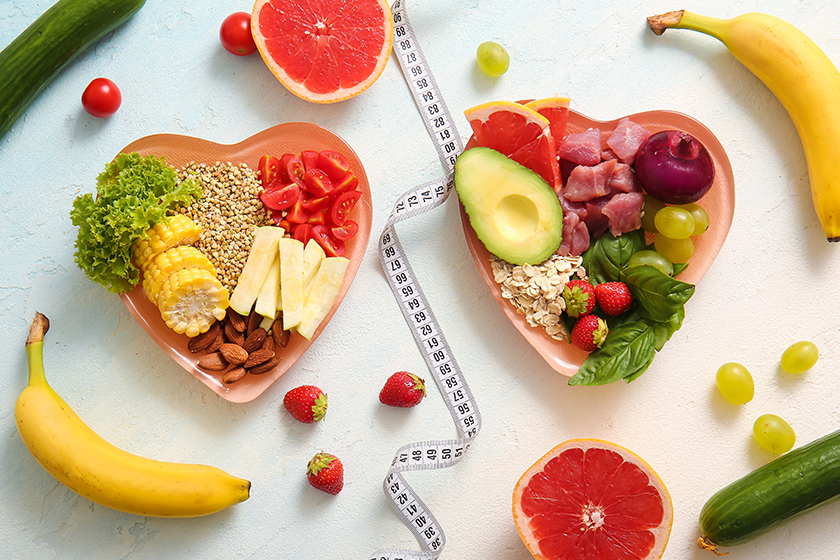 plates fresh healthy products measuring tape light background diet concept