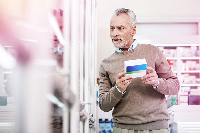 Precious purchaser comparing goods presented in a store
