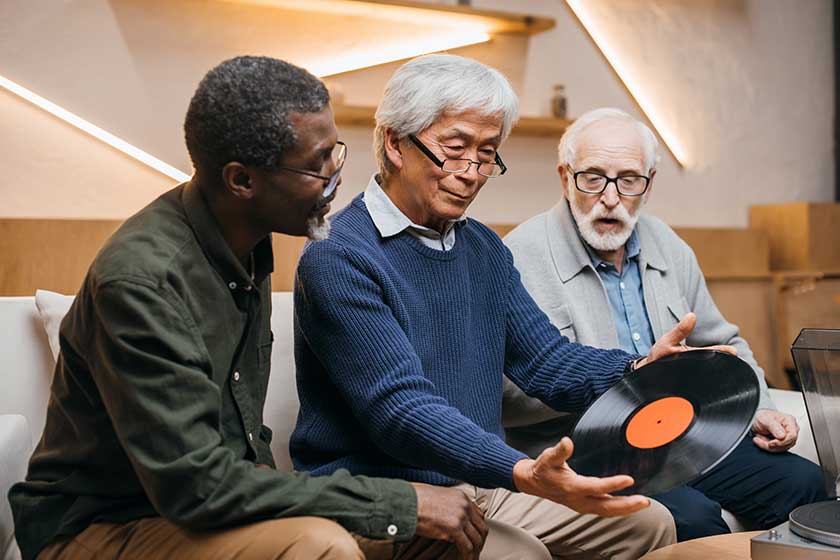 Senior friends with vinyl record Senior friends with vinyl record