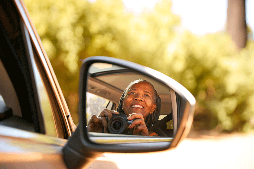 smiling senior female driver camera reflected wing mirror car enjoying smiling senior female driver camera reflected wing mirror car enjoying