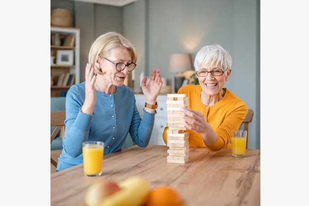 Two senior women female woman friends family sisters play leisure