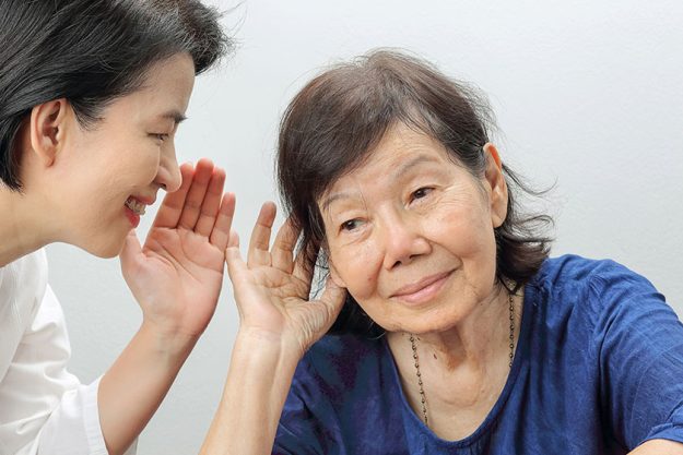 asian seniors woman hearing loss hard of hearing