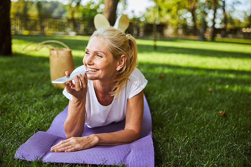 charming woman talking on mobile phone on the street