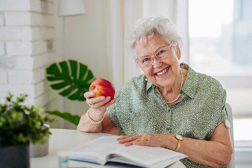 diabetic senior patient using continuous glucose monitor check blood sugar