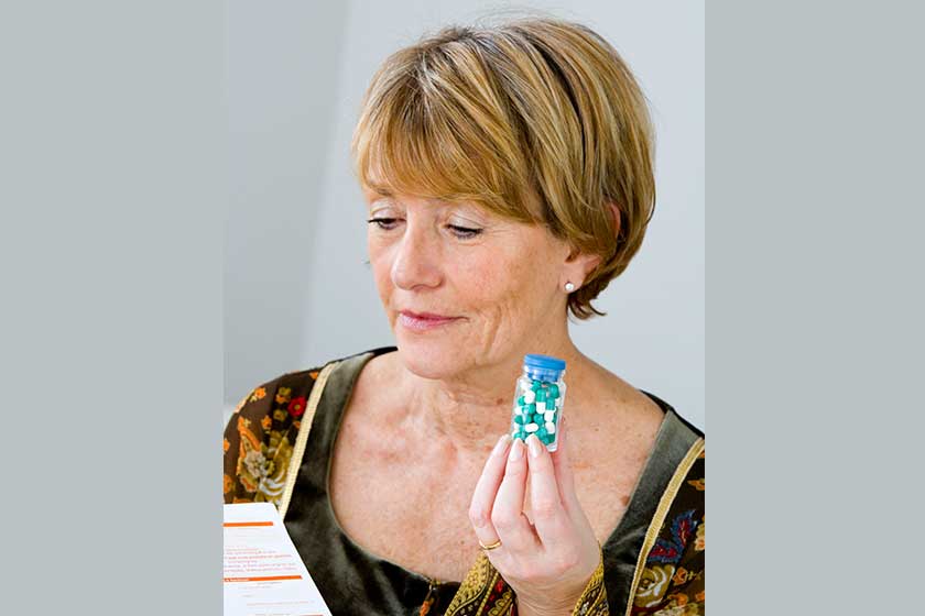 elderly person taking medication