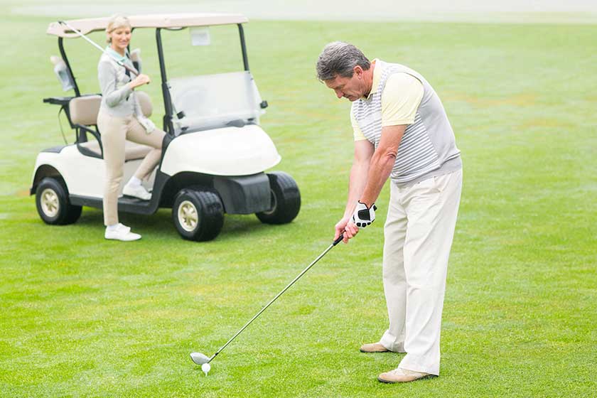 golfer about to tee off golfer about to tee off