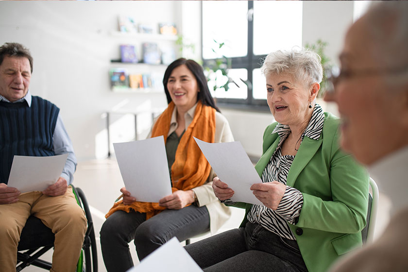 Group seniors singing together choir rehearsal Group seniors singing together choir rehearsal