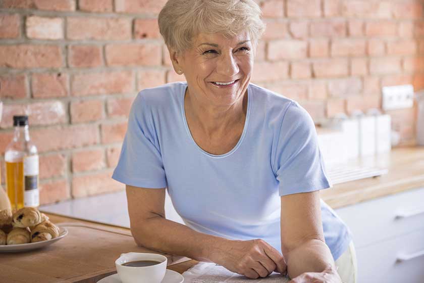 mature smiling woman in kitchen