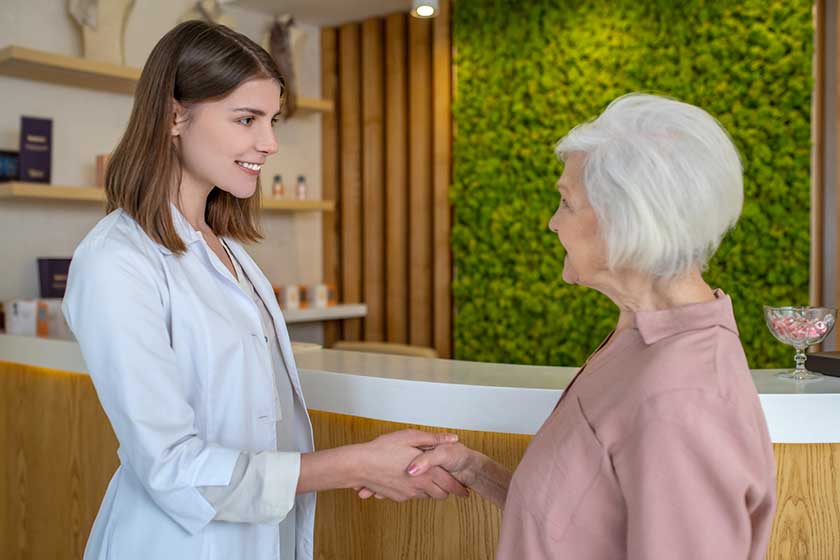 mature woman meeting a cosmetologist in a beauty center