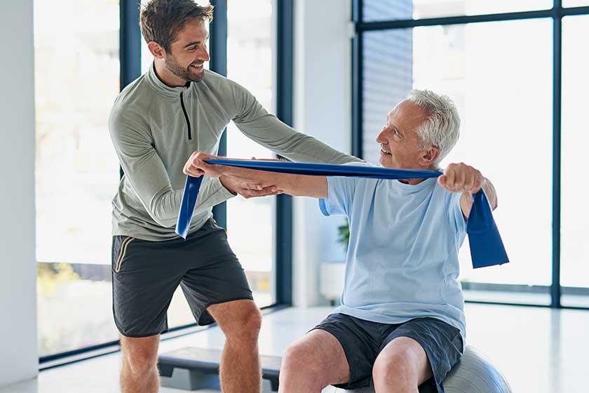 routine has been good young male physiotherapist helping senior man
