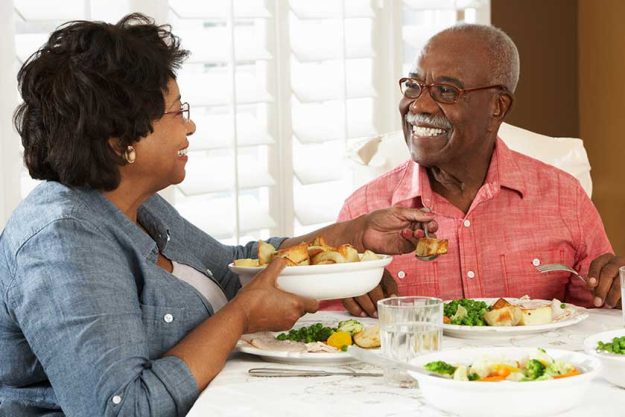 senior couple enjoying meal at home